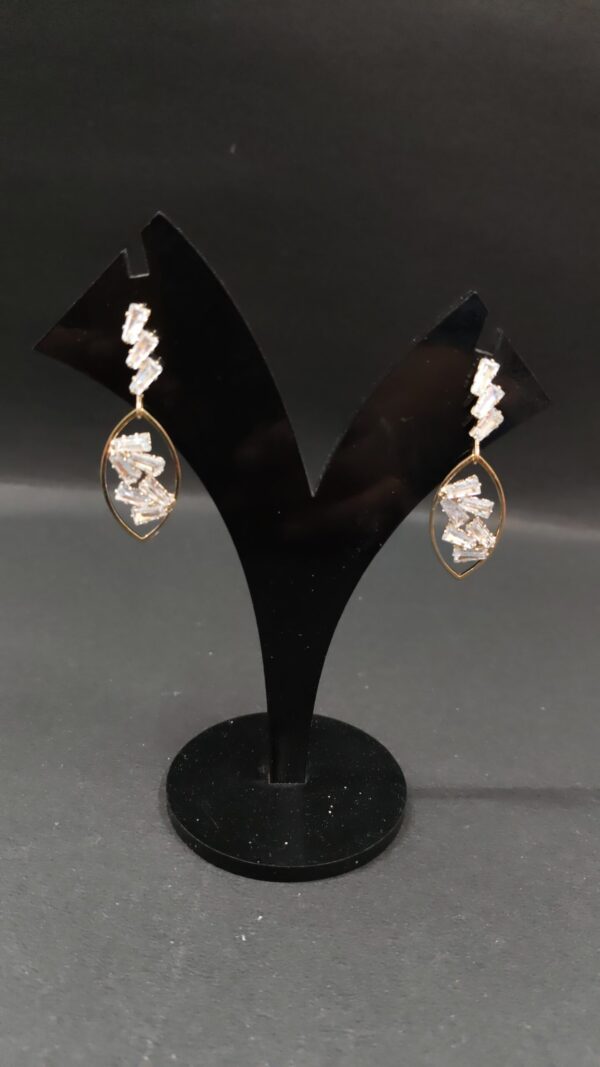 Trendy gold white stone small eye dangle earring